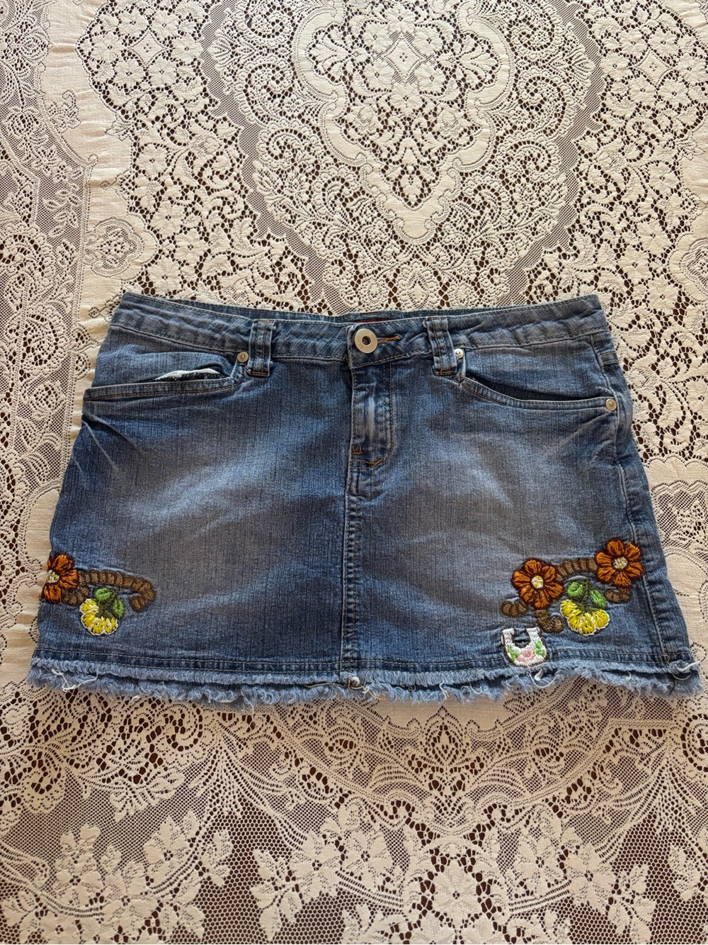denim mini skirt with floral embroidery
